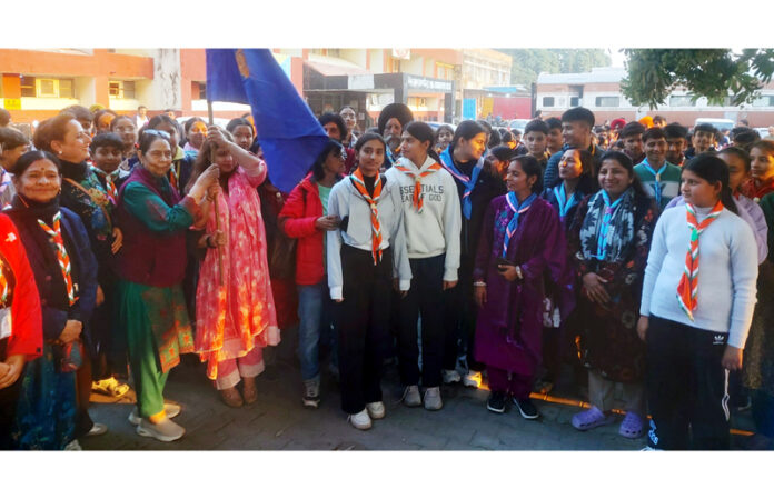 A dignitary flagging off Jammu & Kashmir Bharat Scouts and Guides contingent from Jammu.