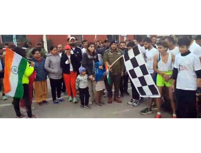 Shiv Kumar Sharma, DIG, JSK Range flagging off Jammu Youth Run 2025 at MA Stadium.