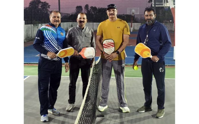 Veteran players posing for group photograph.