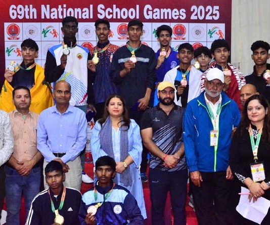 Winners posing along with dignitaries during prize distribution ceremony.