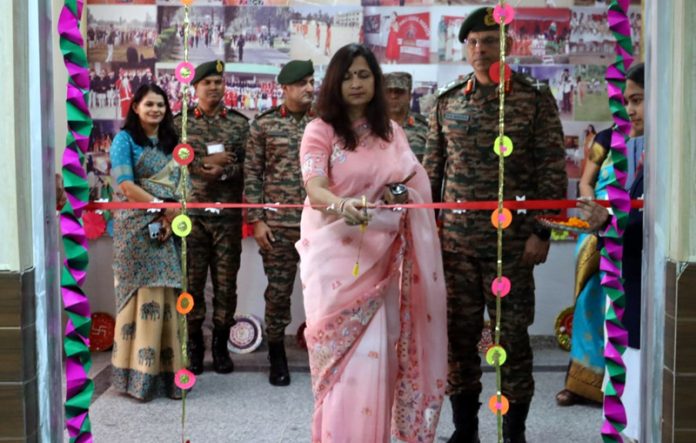 Dignitary cutting a ribbon during a programme.