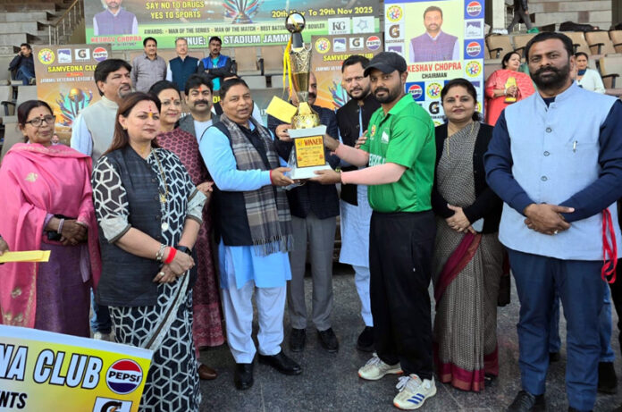 MP Sat Sharma presenting title trophy to captain of winning team.