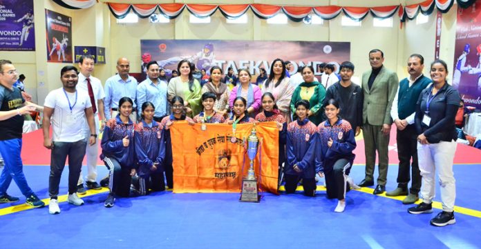 Winning team posing along with trophy. Winning team posing along with trophy.