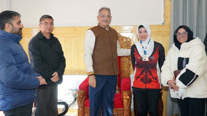 LG Ladakh Kavinder Gupta posing along with woman athlete. LG Ladakh Kavinder Gupta posing along with woman athlete.