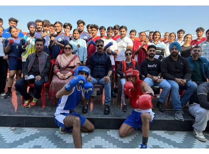 Boxers posing along with dignitaries during closing ceremony.