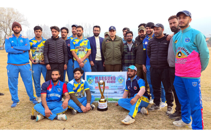 Winning team posing along with dignitaries. -Excelsior/Firdous