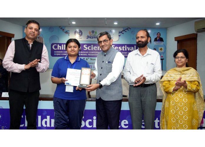 Dignitary presenting trophy and certificates to a winner. Dignitary presenting trophy and certificates to a winner.