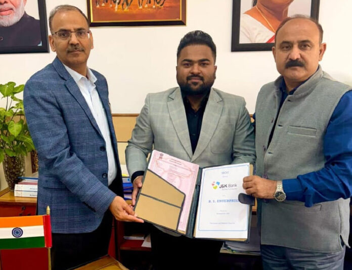 Dignitaries from J&K Bank signing an MoU with representatives of MDB Group in Srinagar on Friday.