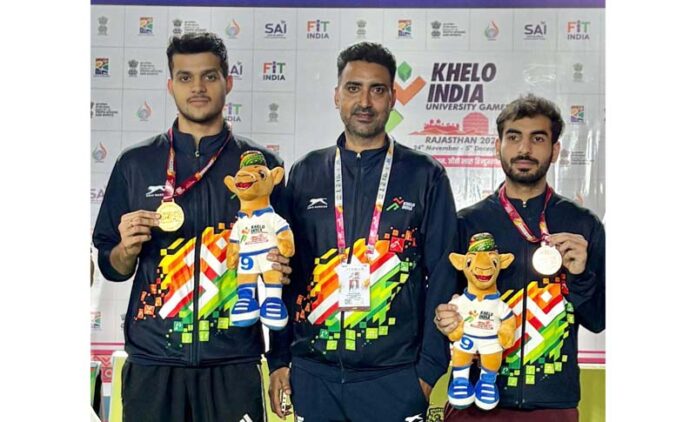 Medal winners posing along with medals.