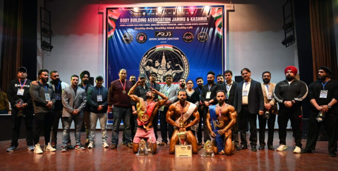 Body Builders pose for photograph with others at the culmination of ‘26th Mr. Jammu Bodybuilding Championship’ on Saturday.