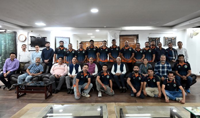 Dignitaries with Jammu University cricket team at the flag-off ceremony.