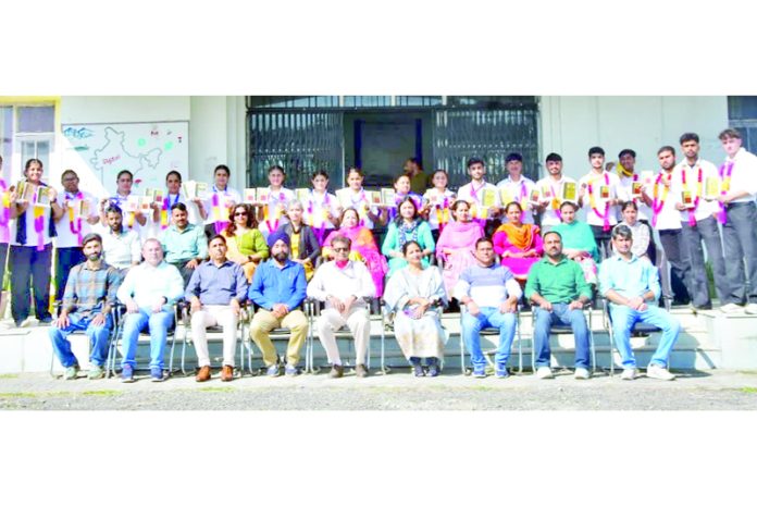 College management posing along with medal winners.
