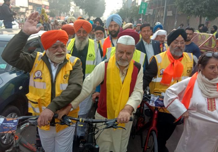 President AIKS Ravinder Pandita participating in religious cycle yatra in Delhi. President AIKS Ravinder Pandita participating in religious cycle yatra in Delhi.