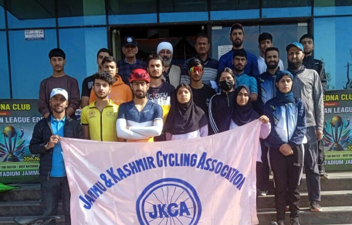 Selected cyclists posing with officials of CAJK at MA Stadium, Jammu.