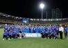 Indian Cricket team posing for a group photograph after defeating Australia.
