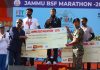 DIG BSF and actor Suniel Shetty presenting cheque to a winner during an event. -Excelsior/Rakesh