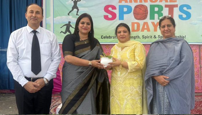 Dignitary receiving plant during a programme. Dignitary receiving plant during a programme.