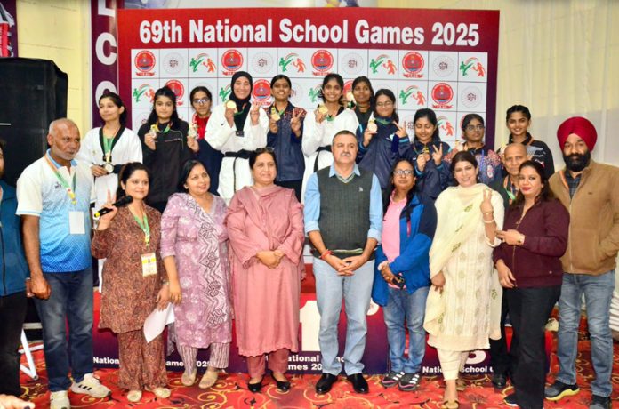 Dignitaries posing along with medal winners.