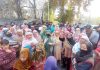 Women during a protest against installation of smart meters in Gadoora area of Ganderbal on Monday. -Excelsior/Firdous Ahmad.