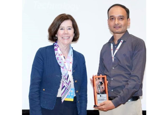 Dr Sudhir receiving memento from Prof Helen Boucher of Tufts University School of Medicine, USA. Dr Sudhir receiving memento from Prof Helen Boucher of Tufts University School of Medicine, USA.