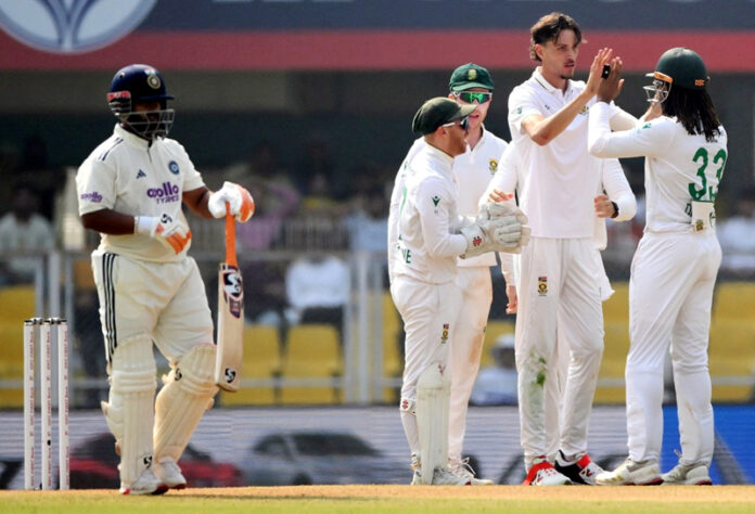 SA players celebrating after fall of an Indian batsman.