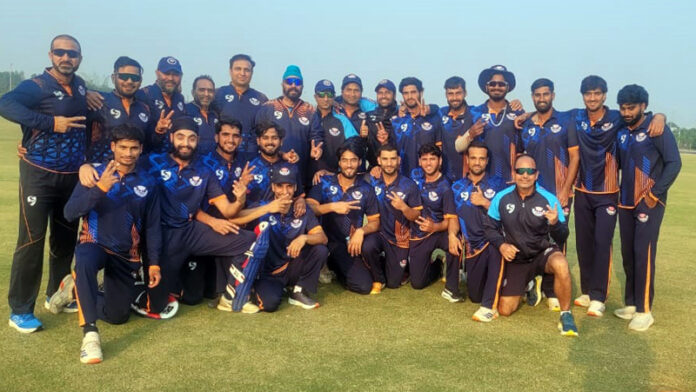 Winning team posing for a group photograph.