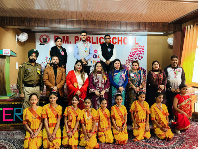 Students posing along with dignitaries during a programme.