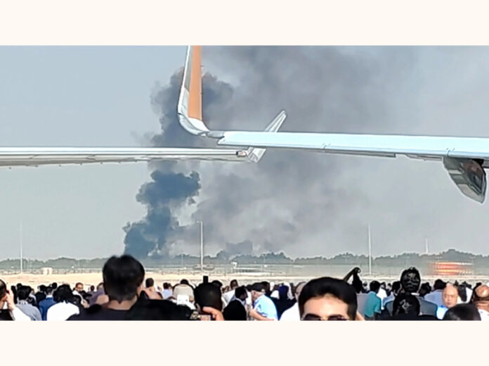 Smoke billows from the site of an aircraft crash during a demonstration at the Dubai Air Show in Dubai on Friday. (UNI)