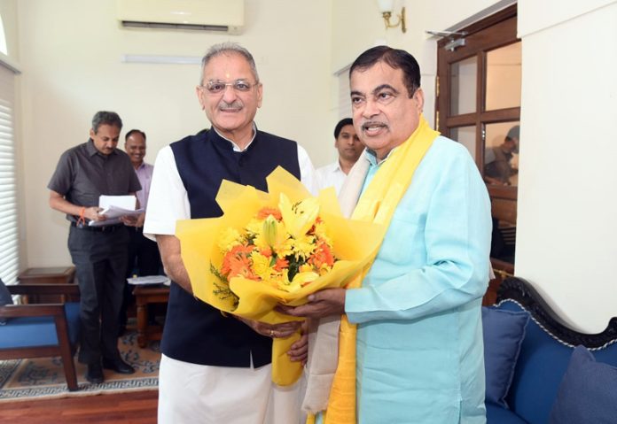 LG Kavinder Gupta greeting Union Minister Nitin Gadkari with a flower bouquet in New Delhi on Tuesday.
