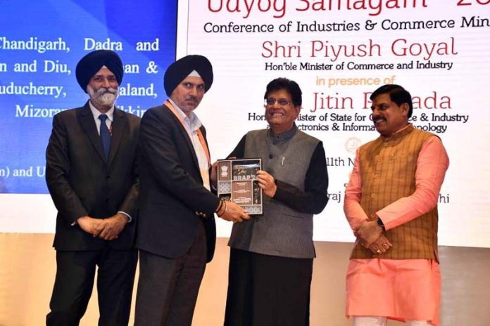 Union Minister Piyush Goyal presenting an award to Commissioner, Secretary I&C Department Vikramjit Singh, in New Delhi. Union Minister Piyush Goyal presenting an award to Commissioner, Secretary I&C Department Vikramjit Singh, in New Delhi.
