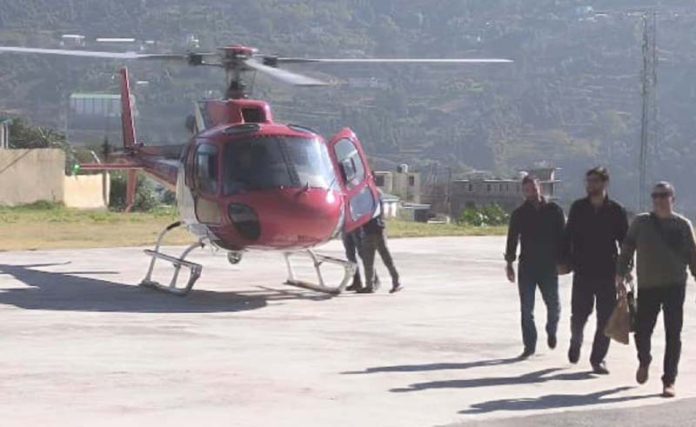 Passengers disembarking a helicopter in Doda on Monday. Passengers disembarking a helicopter in Doda on Monday.