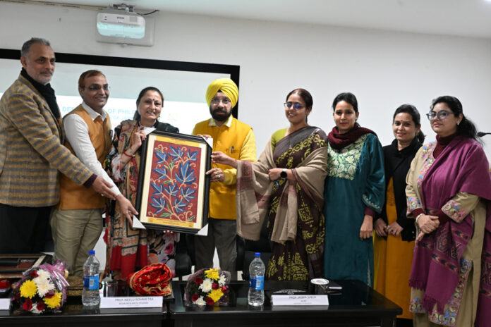 Chief guest being presented a memento during World Philosophy Day celebration event at JU on Thursday.