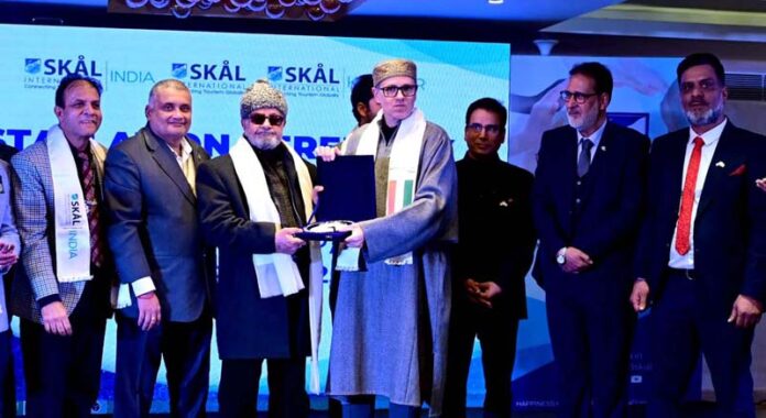 CM Omar Abdullah with members of Skal International during the launch of the 20th club in Kashmir on Saturday. -Excelsior/Shakeel