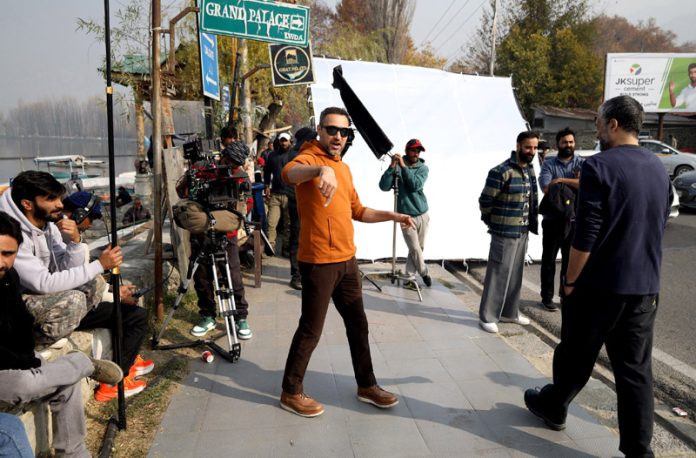 A crew during the shooting of upcoming web series featuring Bollywood actor Imran Khan at Dal Lake in Srinagar on Wednesday. -Excelsior/Shakeel