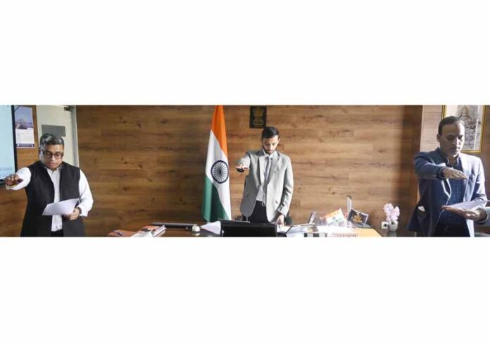 Director Information Nitish Rajora and other senior officers reading out the Preamble of the Constitution on Wednesday.