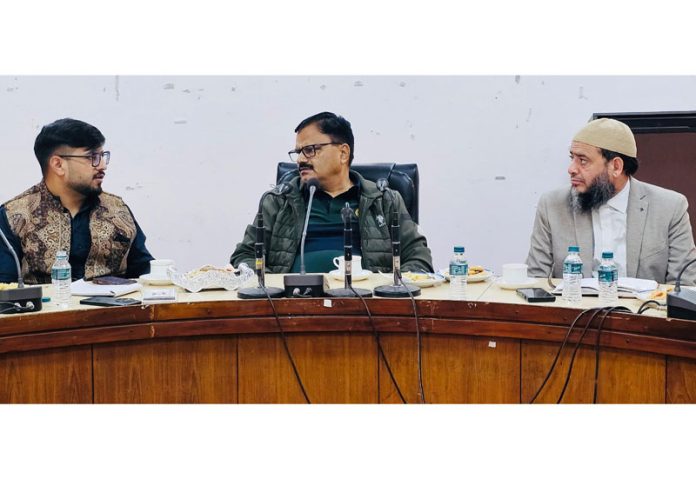 Minister Javed Rana chairing a meeting at Rajouri on Wednesday.