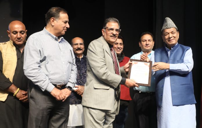 Speaker Abdul Rahim Rather felicitating the members of Yemberzal Foundation in Jammu.
