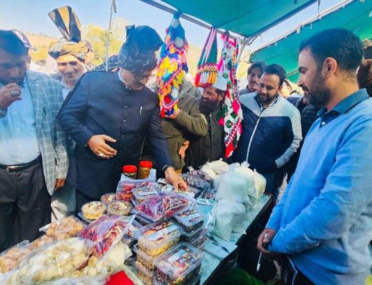 Minister Javed Rana inspecting a stall at an exhibition on Saturday.
