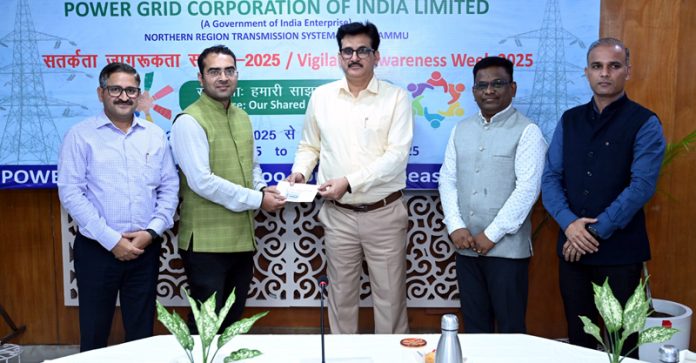 The officials of POWERGRID felicitating a winner during a function in Jammu. The officials of POWERGRID felicitating a winner during a function in Jammu.