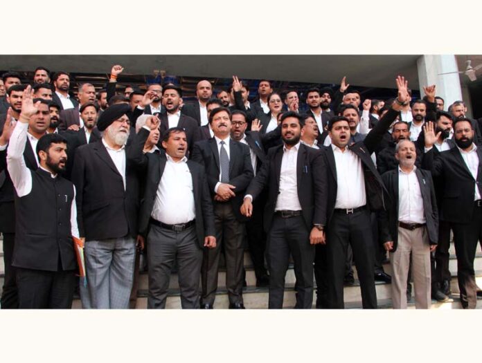 Members of J&K High Court Bar Association Jammu protesting in the court premises at Janipur on Friday. -Excelsior/Rakesh