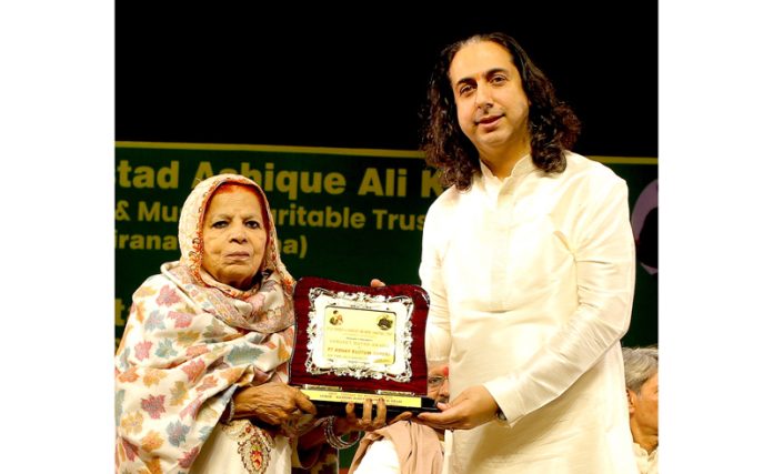 Pandit Abhay Rustum Sopori receiving Sangeet Ratna Award 2025 during a function at New Delhi.