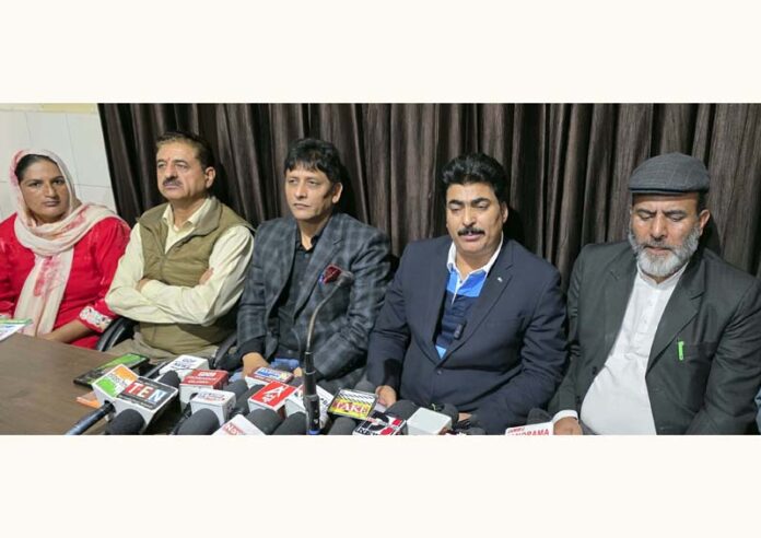TUCC president, Ghulam Rasool Geelani, flanked by other office bearers addressing press conference in Jammu. -Excelsior/Rakesh