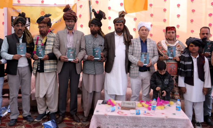 Dignitaries releasing a book on Sunday.