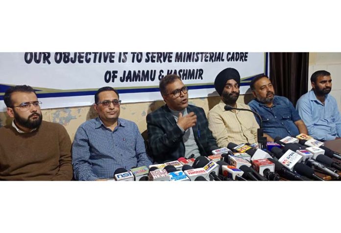 J&K Clerical Association employees interacting with media persons in Jammu on Friday. -Excelsior/Rakesh