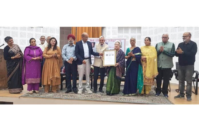 Dignitaries presenting an award to Shashi Ratan during a function in Jammu. Dignitaries presenting an award to Shashi Ratan during a function in Jammu.