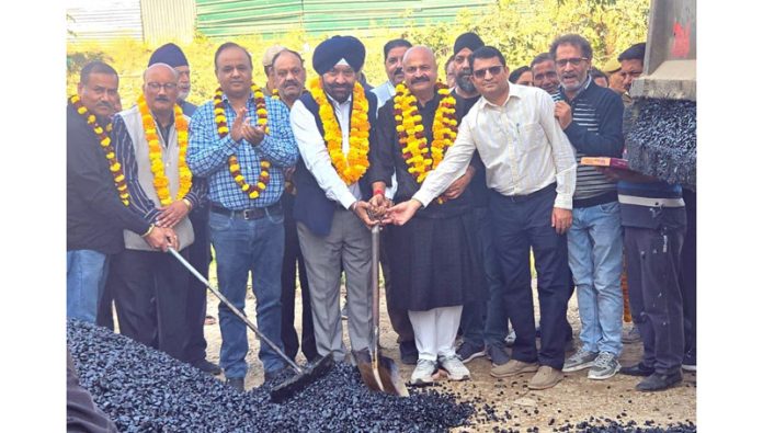 MLA Jammu East Yudhvir Sethi starting blacktopping work at Ware House area of Jammu. MLA Jammu East Yudhvir Sethi starting blacktopping work at Ware House area of Jammu.