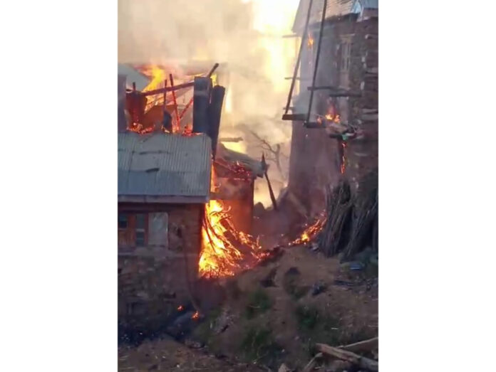 A house on fire in Ramban on Sunday. — Excelsior/Pervaiz Mir