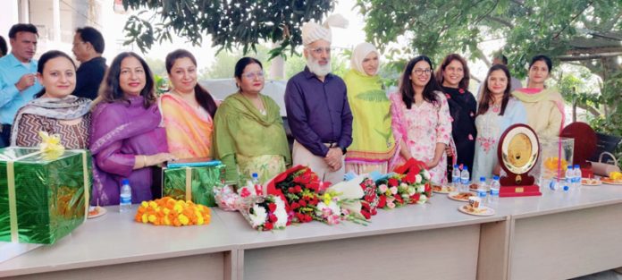 Dignitaries with the retirees at JPDCL Jammu.