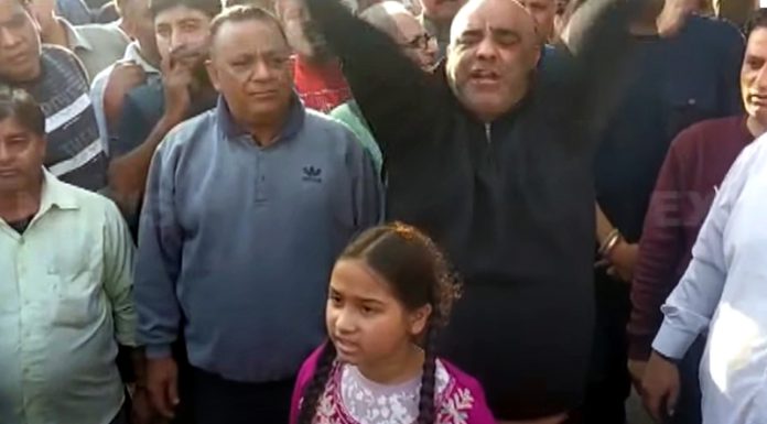 Family members of Puran Chand staging a demonstration at Daljeet Chowk RS Pura on Tuesday.