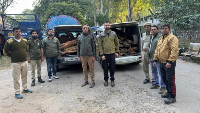 Forest team along with seized vehicles loaded with illegal Khairwood in Jammu.